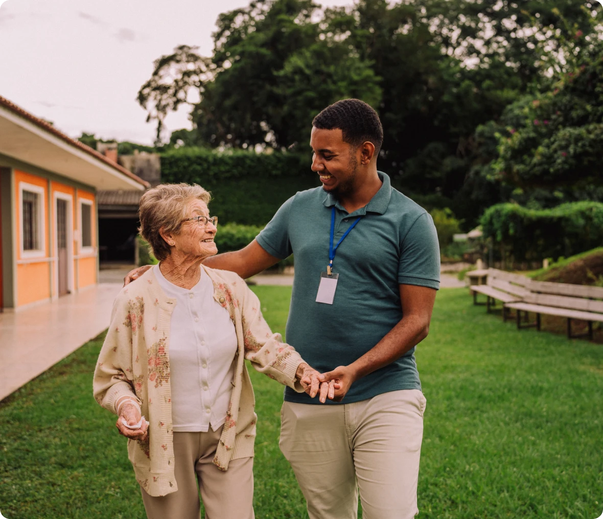 Senior woman and caregiver enjoying a walk