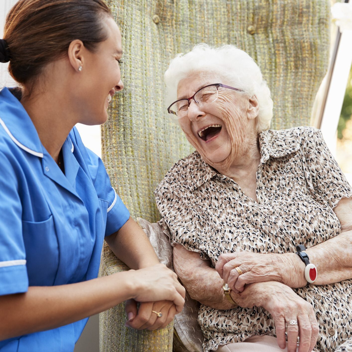 Happy interaction between caregiver and older adult