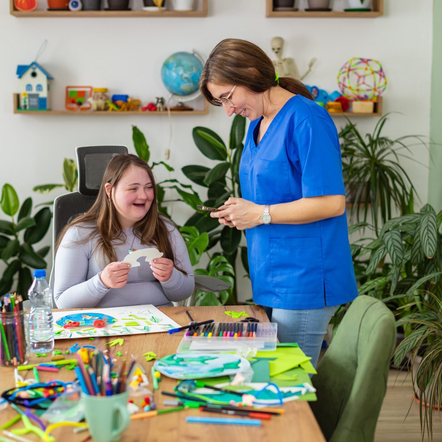 Teacher and student enjoying art project